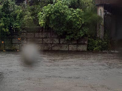 集中豪雨排水溝排水不良による道路浸水被害